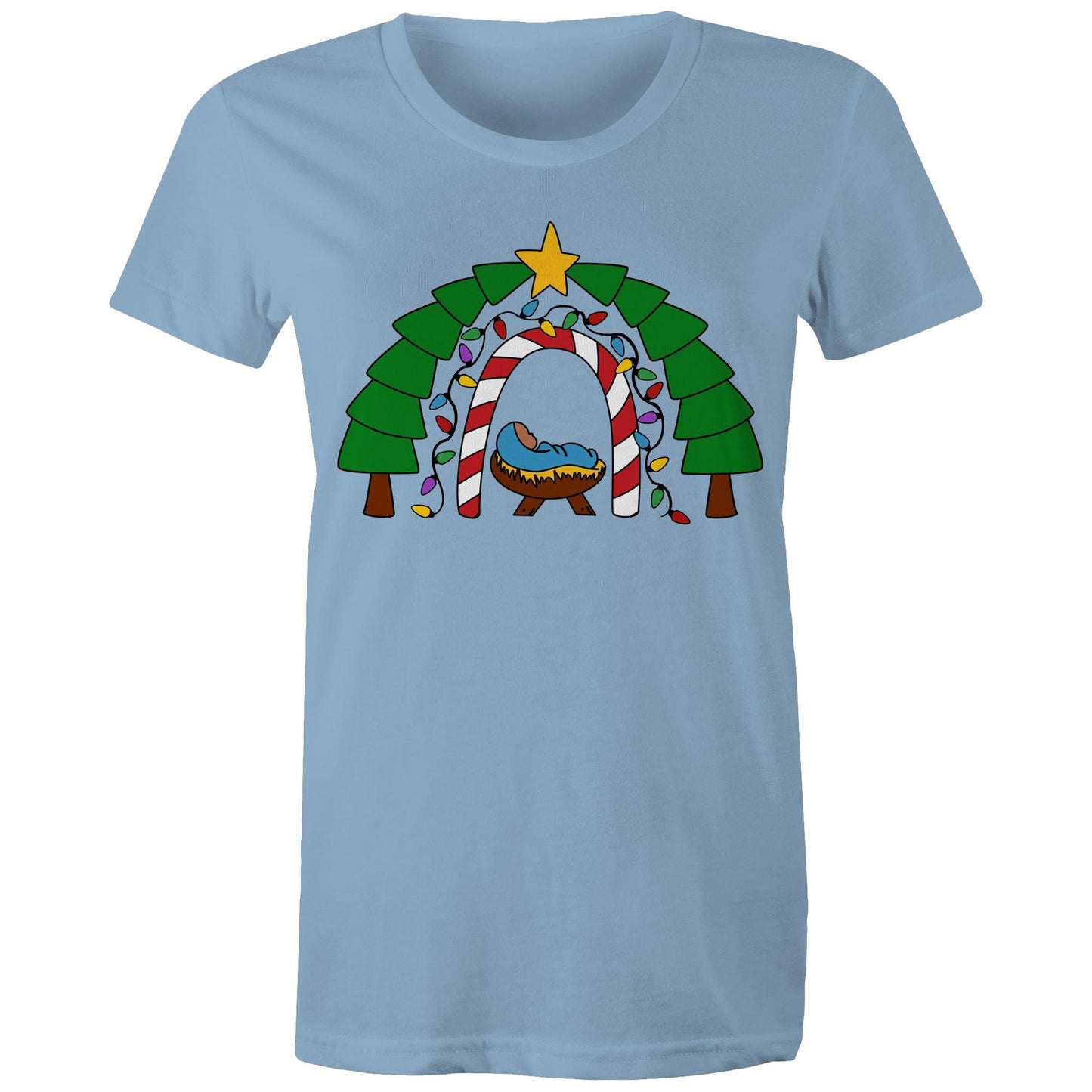 Women's Christian Carolina Blue T-shirt by Christianitee featuring a cosy nativity scene with baby Jesus in a manger, framed by a candy cane and Christmas light arch, evergreen trees, and a star. A festive design celebrating the joy and meaning of Christmas.