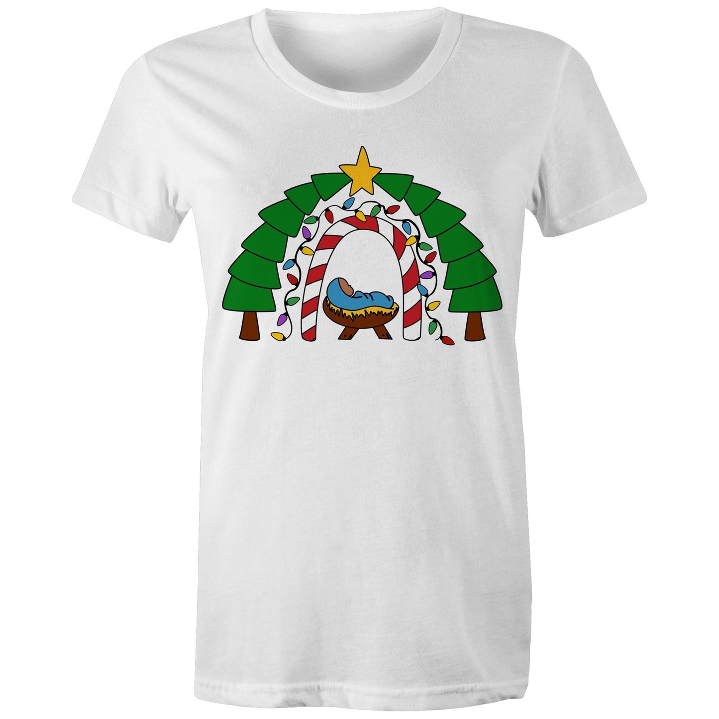 Women's Christian White T-shirt by Christianitee featuring a cosy nativity scene with baby Jesus in a manger, framed by a candy cane and Christmas light arch, evergreen trees, and a star. A festive design celebrating the joy and meaning of Christmas.